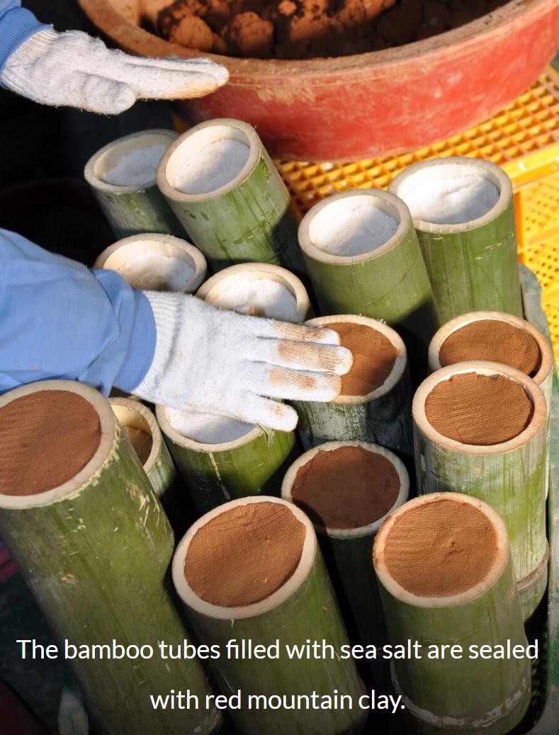 Red Clay being used to seal the ends of the bamboo salt